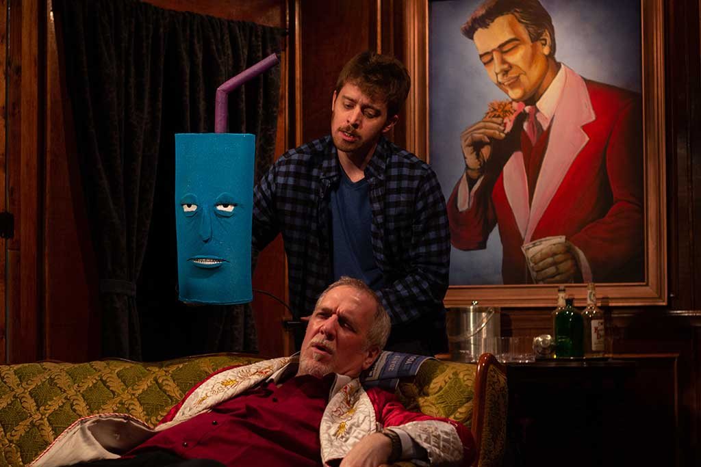 Production photo: 16 Chris Sykes with Puppet / Kevin Grammer · Remember Rudy